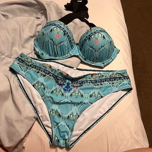 It’s blue I’m not really sure of the design but it’s cute